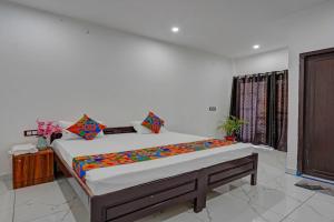 a bedroom with a large bed in a room at Park Palace in Lucknow