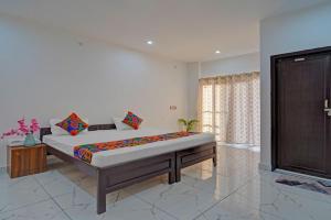 a bedroom with a large bed in a room at Park Palace in Lucknow