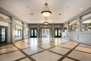 an empty hallway with a large lobby with a large ceiling at Inn Marin and Suites, an Ascend Collection Hotel in Novato +78 photos
