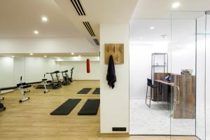 a gym with pilates equipment and a glass wall at Shota @ Rustaveli Boutique Hotel in Tbilisi City