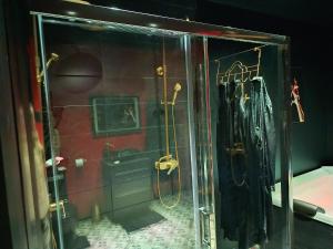 a shower with a glass door in a bathroom at L'instant Désir love room jacuzzi in Ferrières +24 photos