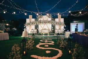 a wedding altar with lights and a on the grass at FOX Hotel Jimbaran Beach Bali in Jimbaran +69 photos