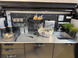 a kitchen with a counter with some baskets of food at Berg & See Hideaway in Mitterstein