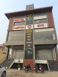 two motorcycles parked in front of a building at Hotel Plain A Quiet Stay in Mubārikpur +32 photos