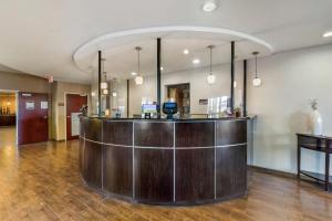 a lobby with a wooden counter in a building at Comfort Suites Blythe in Blythe +32 photos