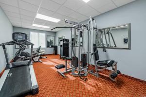 a gym with cardio equipment in a room at Quality Inn in Ottawa