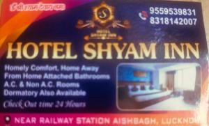 a sign for a hotel shymymym inn at Hotel shyama inn in Lucknow
