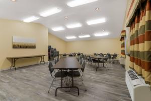 a conference room with tables and chairs in it at Econo Lodge Inn & Suites Yankton in Yankton +40 photos