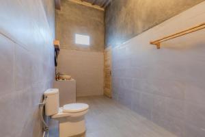 a bathroom with a toilet and a sink at Menjangan Dive Lodge in Banyuwedang +71 photos