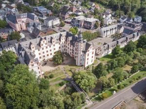an aerial view of a building in a city at Ferienwohnung -Alte Backstube- in Hadamar