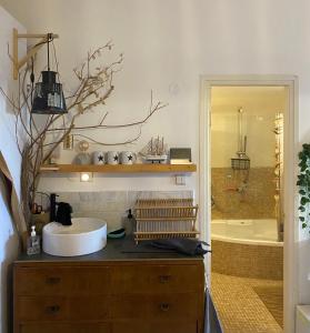 a bathroom with a sink and a bath tub at Risan Chill in Eilat +11 photos