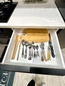 a drawer filled with utensils in a kitchen counter at Apartment in Sousse in Sousse