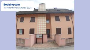 a house with a roof with a turret at Asiago Millepini in Asiago