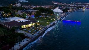 an aerial view of a beach at night at RA Resort Otel in Küçükkuyu