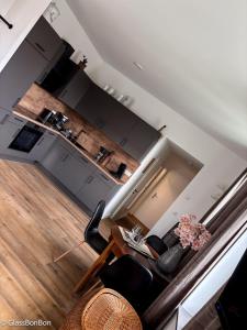 an aerial view of a kitchen and a living room at Altstadtflair - Ruppin Quartier Stadtmitte in Neuruppin