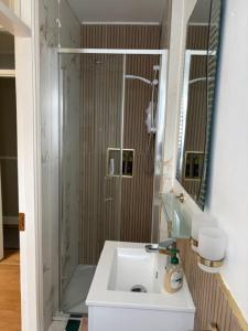 a bathroom with a sink and a shower at Tess's Guest House R95K6N1 This Property is unsuitable for children under 12 years old in Freshford