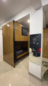 a living room with a fireplace in a room at Dostel in Bhowāli