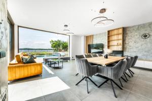 a dining room with a table and chairs at Villa K&L Pasohlávky in Pasohlávky