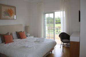 Ένα ή περισσότερα κρεβάτια σε δωμάτιο στο Quinta Formosa - Villas +42 φωτογραφίες