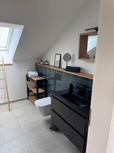 a bathroom with a sink and a toilet at Alte Feuerwache "nur wenige Minuten von Freiburg" in Hugstetten +111 photos