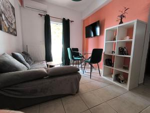 a living room with a couch and a table at Johanna's apartment 2 in Preveza