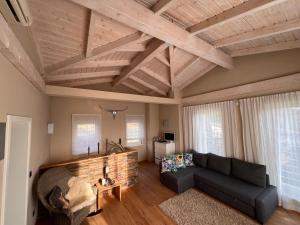a living room with a couch and a brick wall at Erfurt Haus Paradies in Erfurt