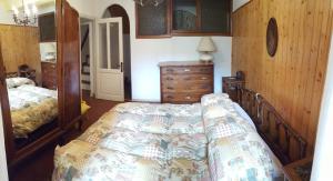 מיטה או מיטות בחדר ב-Casa Belvedere