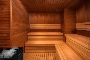 an empty sauna with wooden floors and wooden walls at Clarion Congress Hotel Brno in Brno +55 photos