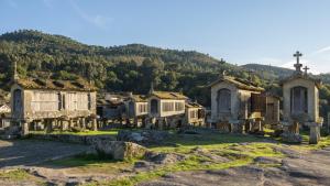 an old village with a mountain in the background at Studio Gerês in Geres