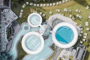an overhead view of three buildings and a swimming pool at MYALPS Jordans Lodge in Längenfeld +31 photos
