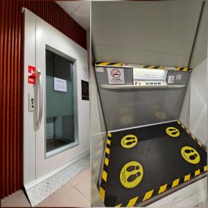 a machine with a sign on the floor next to a door at Good2Stay Budget Hotel l Lift l Coway Water l WIFI6 l Laundromat in Malacca