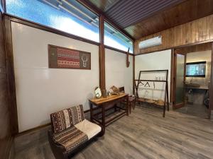 a room with a desk and a chair and a table at Laben Ecolodge in Na Dong