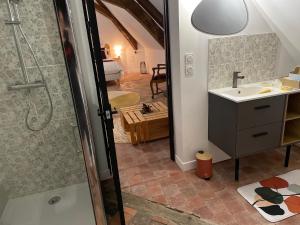 a bathroom with a shower and a sink and a tub at Le Petit Monde de Molly in Toucy +32 photos