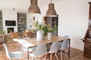 a dining room with a table and chairs at Living4Malaga Monte Sancha Deluxe View in Málaga