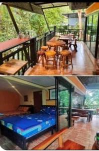 a house with a deck with a bench and tables at Kaengkrachan River Hut in Kaeng Krachan
