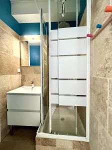a bathroom with a shower and a sink at Central Océan in Les Sables-d'Olonne +33 photos