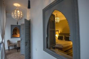 Postel nebo postele na pokoji v ubytování Riad Utopia Suites And Spa