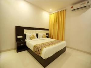a bedroom with a large bed in a room at Hotel Anchal Villa By YB Hotel in Udaipur +11 photos