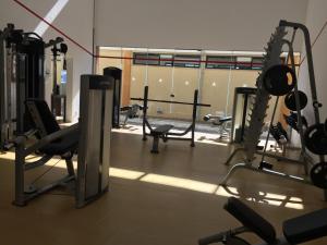 a gym with a row of treadmills and machines at Cond Mediterrâneo I - Iberostate in Praia do Forte