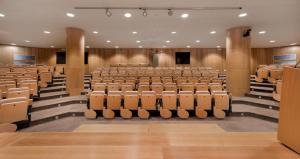 an auditorium with rows of chairs in a building at Secrets Lanzarote Resort & Spa - Adults Only (+18) in Puerto Calero