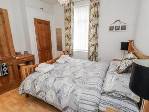 a bedroom with a bed with towels on it at Sea Mist in Newbiggin-by-the-Sea