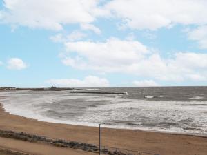a view of the beach on a cloudy day at Sea Mist in Newbiggin-by-the-Sea