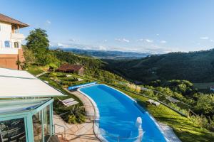 a view of a swimming pool at a resort at das kappel wein gut hotel in Kitzeck im Sausal