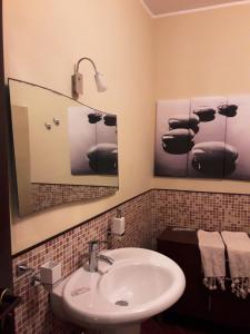 a bathroom with a sink and a mirror at Villa Lucia in Lampedusa