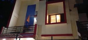a building with a window on the side of it at Cozzy in Nagpur