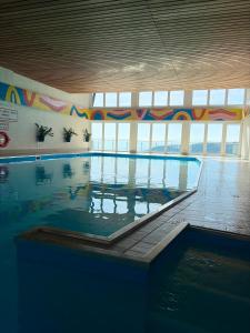 a large swimming pool in a large building at Bergidylle Simonhöhe, Kärnten in Zirkitz