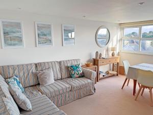a living room with a couch and a table at Sandbourne in Bournemouth