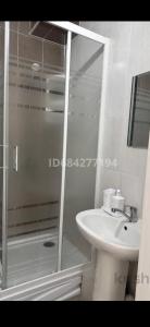 a bathroom with a shower and a sink at Promenad Burabay 45P in Borovoye