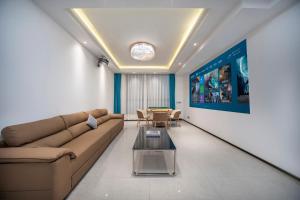 a living room with a couch and a table at First encounter with a homestay in Fenghuang County +54 photos