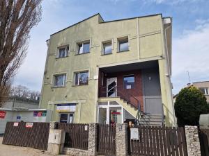 a building with its door open on a street at Promień 4 by Zen4Guest - Biskupin in Wrocław